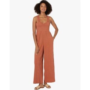 Like new Roxy rust color pocketed jumpsuit. So comfy. Size small.